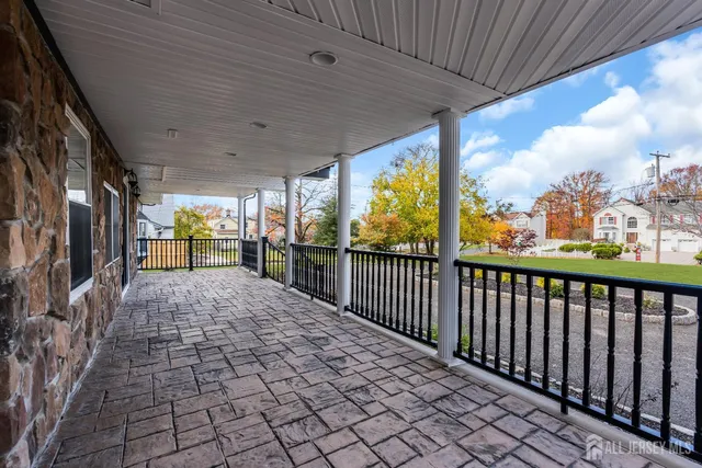 a bathroom with a shower a sink and mirror