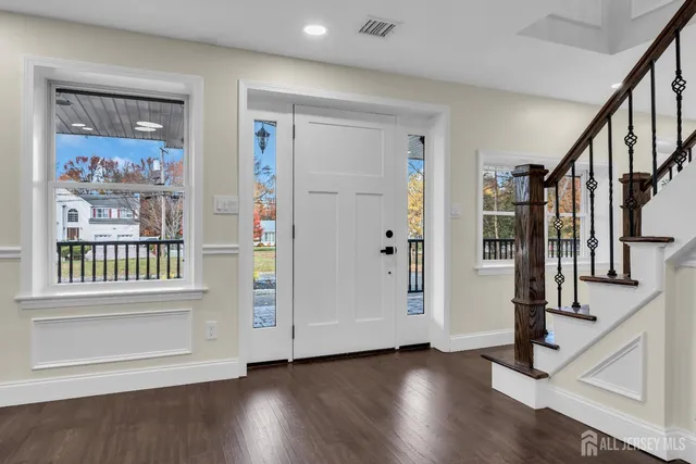 a kitchen with stainless steel appliances granite countertop a sink and cabinets