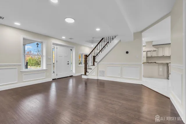 a kitchen with stainless steel appliances granite countertop a sink and a stove