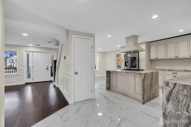 a view of a an empty room with wooden floor