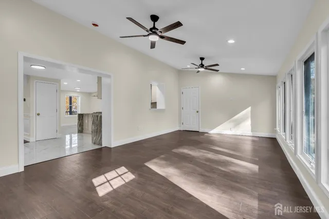 a view of a house with a yard patio and fire pit