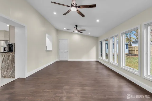 a view of a house with a yard and sitting area