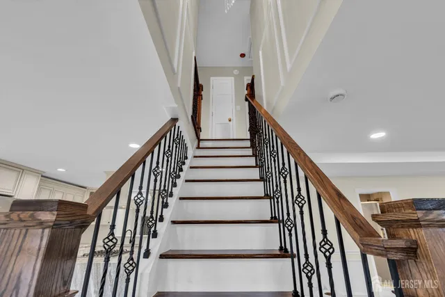 a front view of a building with a garden