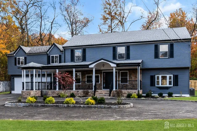 a view of an entryway with wooden floor and door