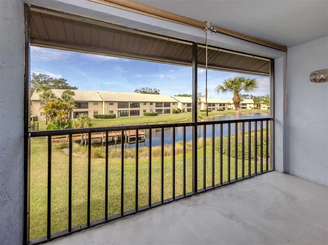 a view of a glass door and a balcony