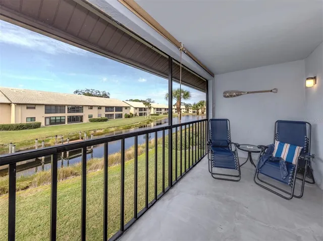 a view of a balcony with chairs