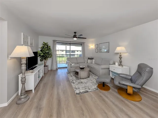 a living room with furniture and a table