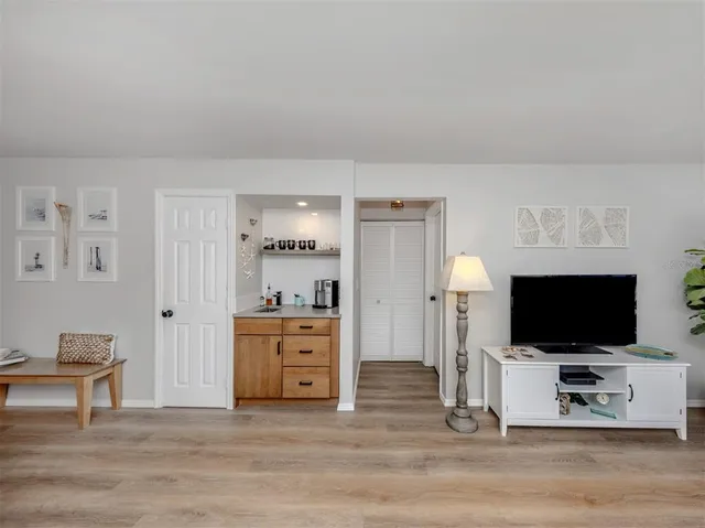 a view of a livingroom with furniture and a flat screen tv