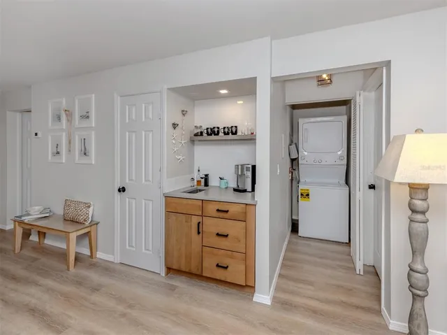 a living room with furniture and a dresser