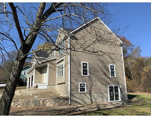 3 Upland Road Ashland, MA 01721 - Photo 2 of 5 a view of a white house with a snow on the side of a road