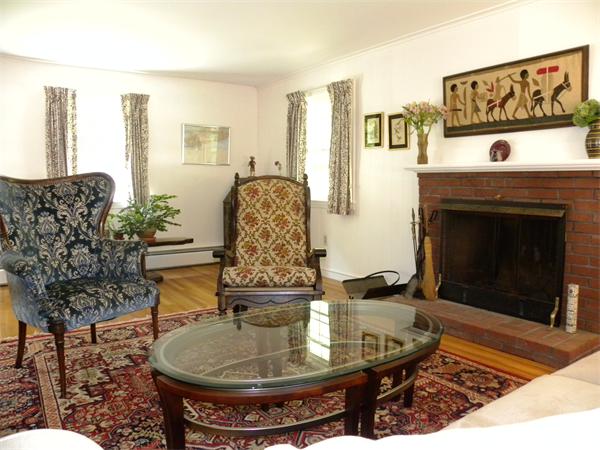 63 High Plain Road Andover, MA 01810 - Photo 11 of 15 a living room with furniture and a fireplace