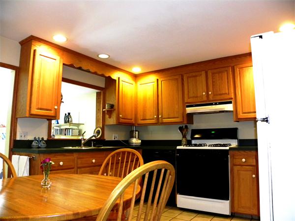 63 High Plain Road Andover, MA 01810 - Photo 2 of 15 a kitchen with a sink a counter top space and cabinets