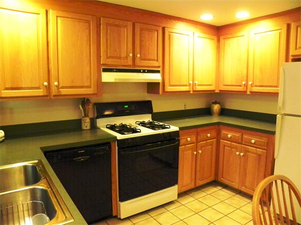 63 High Plain Road Andover, MA 01810 - Photo 4 of 15 a kitchen with a sink and a stove top oven