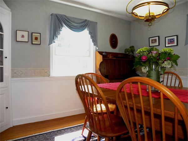63 High Plain Road Andover, MA 01810 - Photo 6 of 15 a view of a dining room with furniture and chandelier