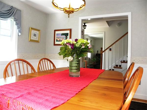 63 High Plain Road Andover, MA 01810 - Photo 7 of 15 a bedroom with bed and a chandelier