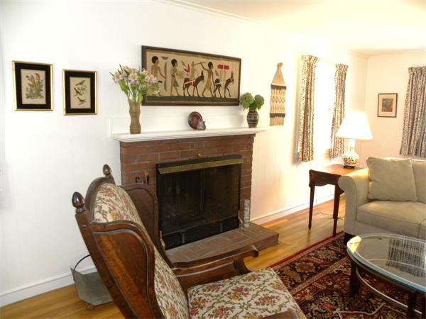 63 High Plain Road Andover, MA 01810 - Photo 8 of 15 a living room with furniture a flat screen tv and a fireplace