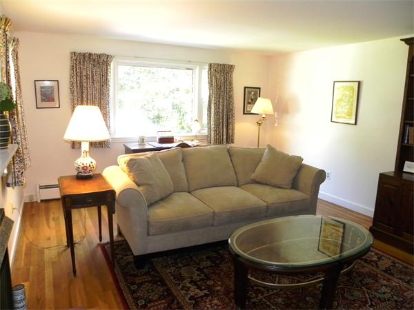 63 High Plain Road Andover, MA 01810 - Photo 9 of 15 a living room with furniture and a lamp