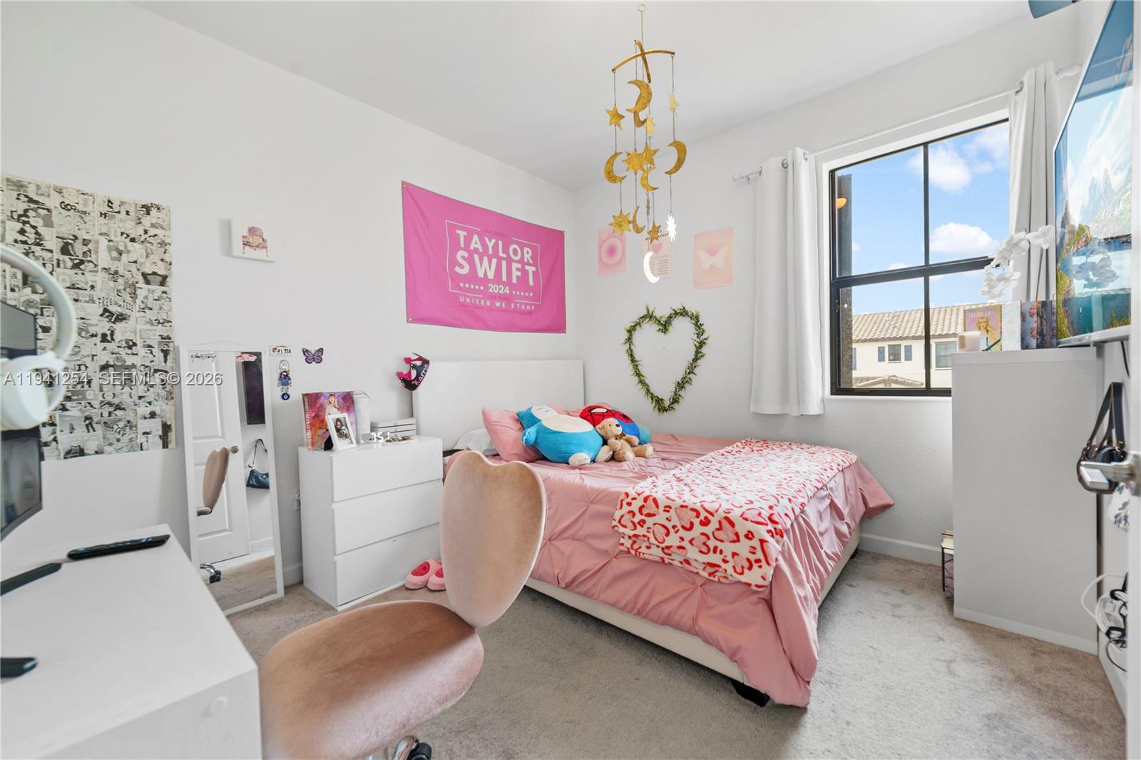 11805 Southwest 245 Terrace Homestead, FL 33032 - Photo 18 of 37 a bedroom with a bed and a window