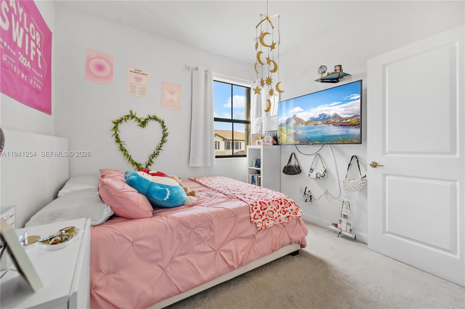 11805 Southwest 245 Terrace Homestead, FL 33032 - Photo 19 of 37 a bedroom with a bed and flat screen tv