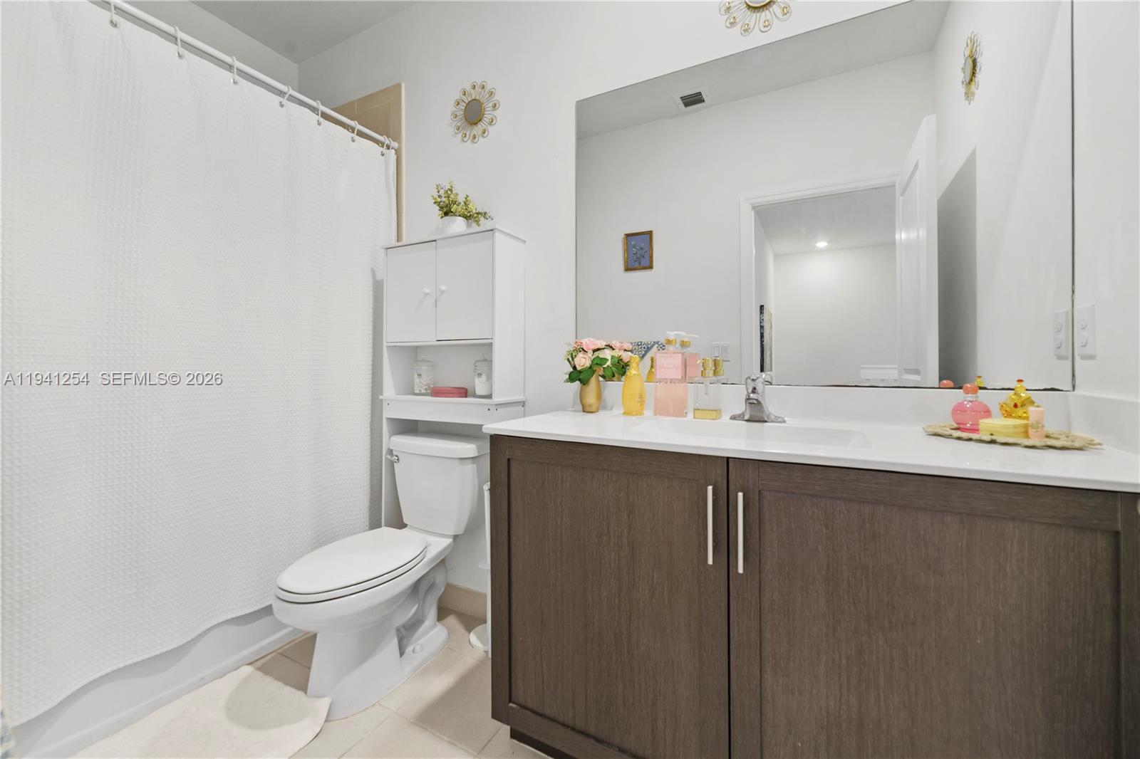 11805 Southwest 245 Terrace Homestead, FL 33032 - Photo 22 of 37 a bathroom with a sink a toilet and shower