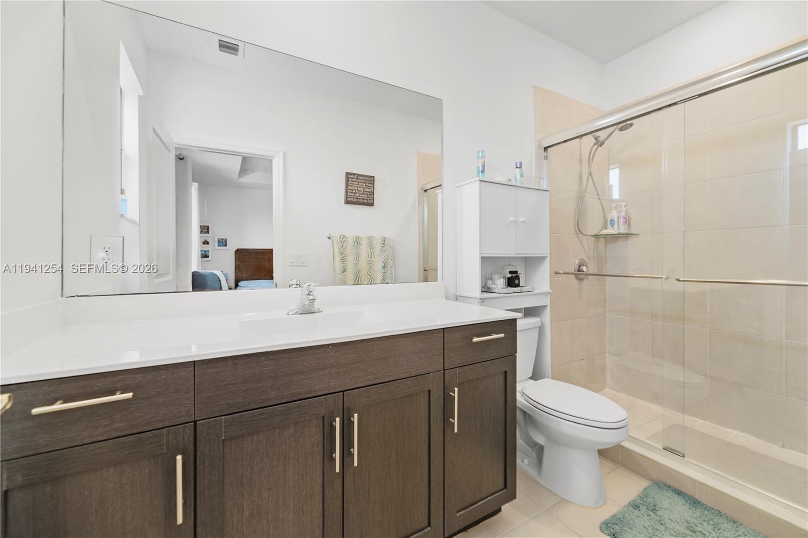 11805 Southwest 245 Terrace Homestead, FL 33032 - Photo 26 of 37 a bathroom with a sink a toilet and shower