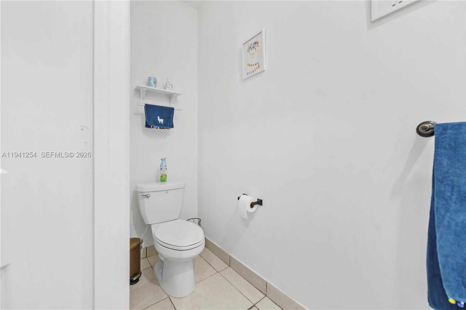 11805 Southwest 245 Terrace Homestead, FL 33032 - Photo 29 of 37 a white toilet sitting next to a white wall