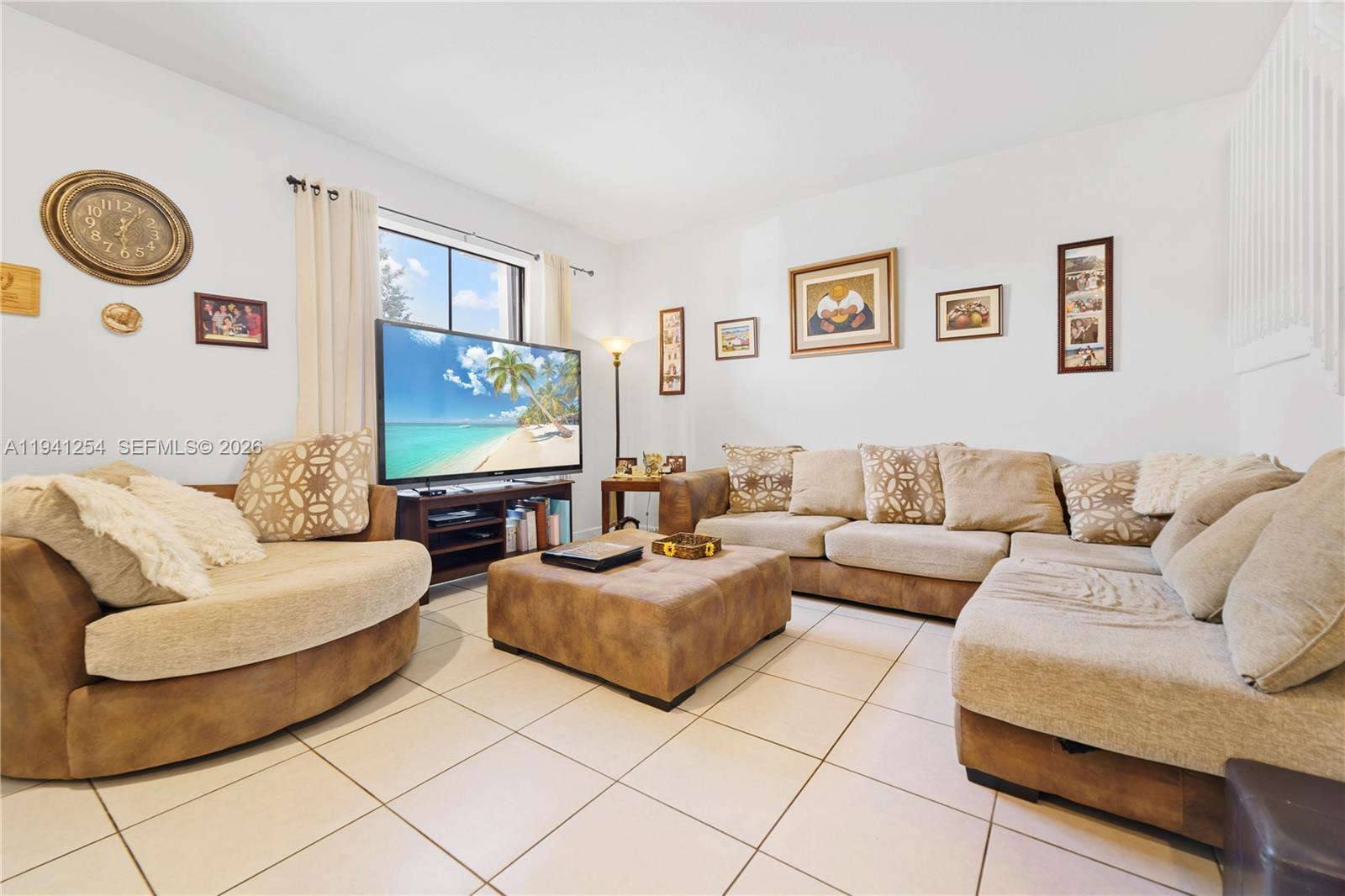 11805 Southwest 245 Terrace Homestead, FL 33032 - Photo 5 of 37 a living room with couches and a flat screen tv