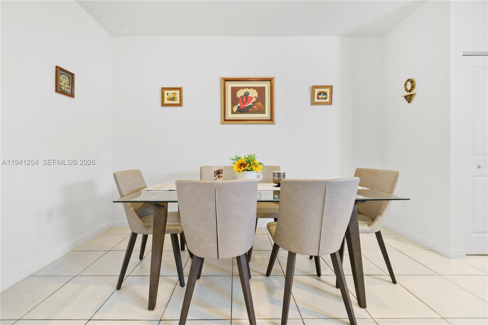 11805 Southwest 245 Terrace Homestead, FL 33032 - Photo 6 of 37 a view of a dining room with furniture and wooden floor