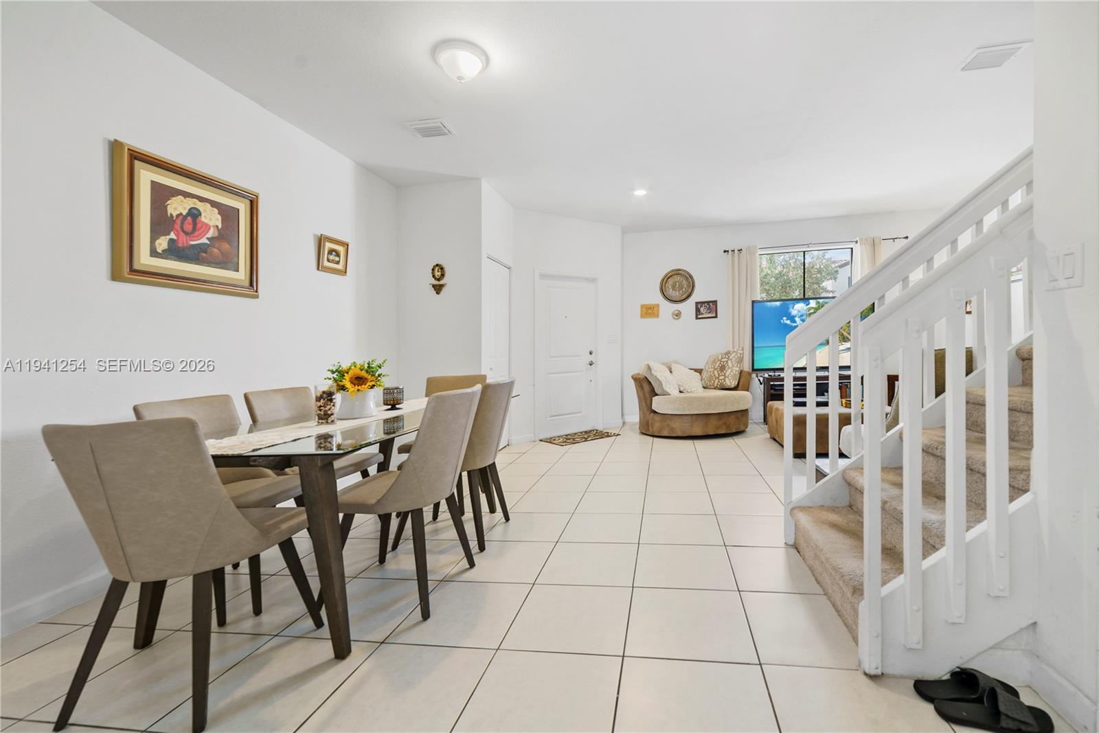11805 Southwest 245 Terrace Homestead, FL 33032 - Photo 7 of 37 a dining room with furniture and wooden floor