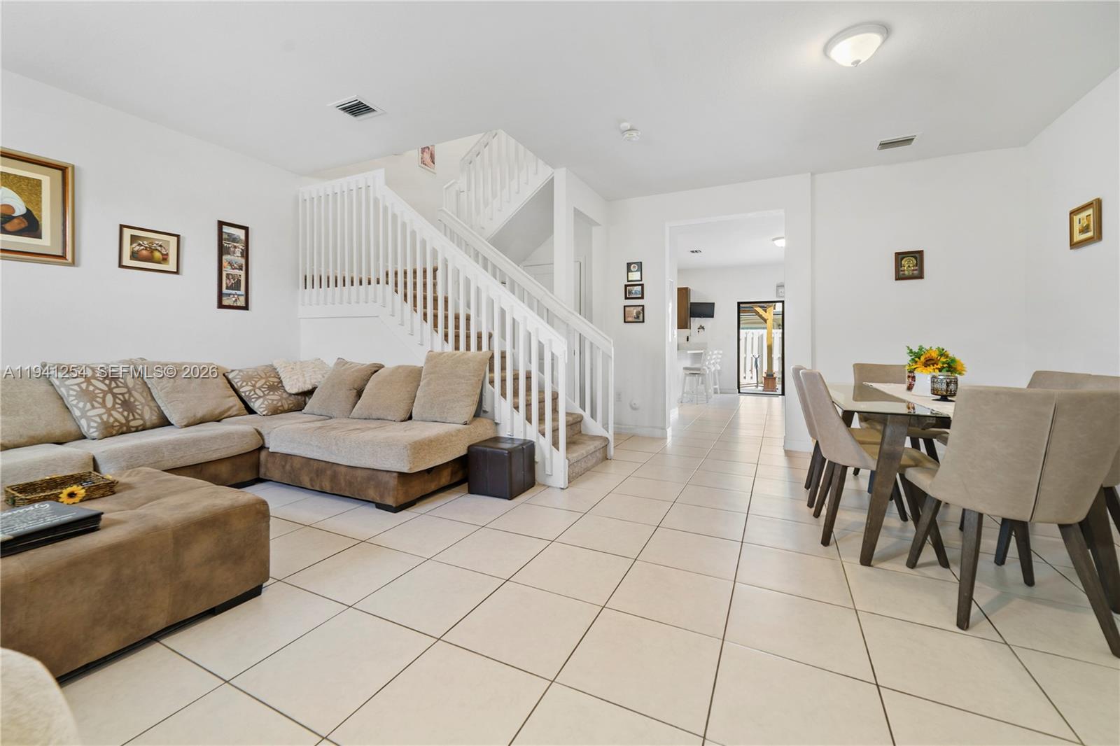 11805 Southwest 245 Terrace Homestead, FL 33032 - Photo 8 of 37 a living room with furniture and a dining table