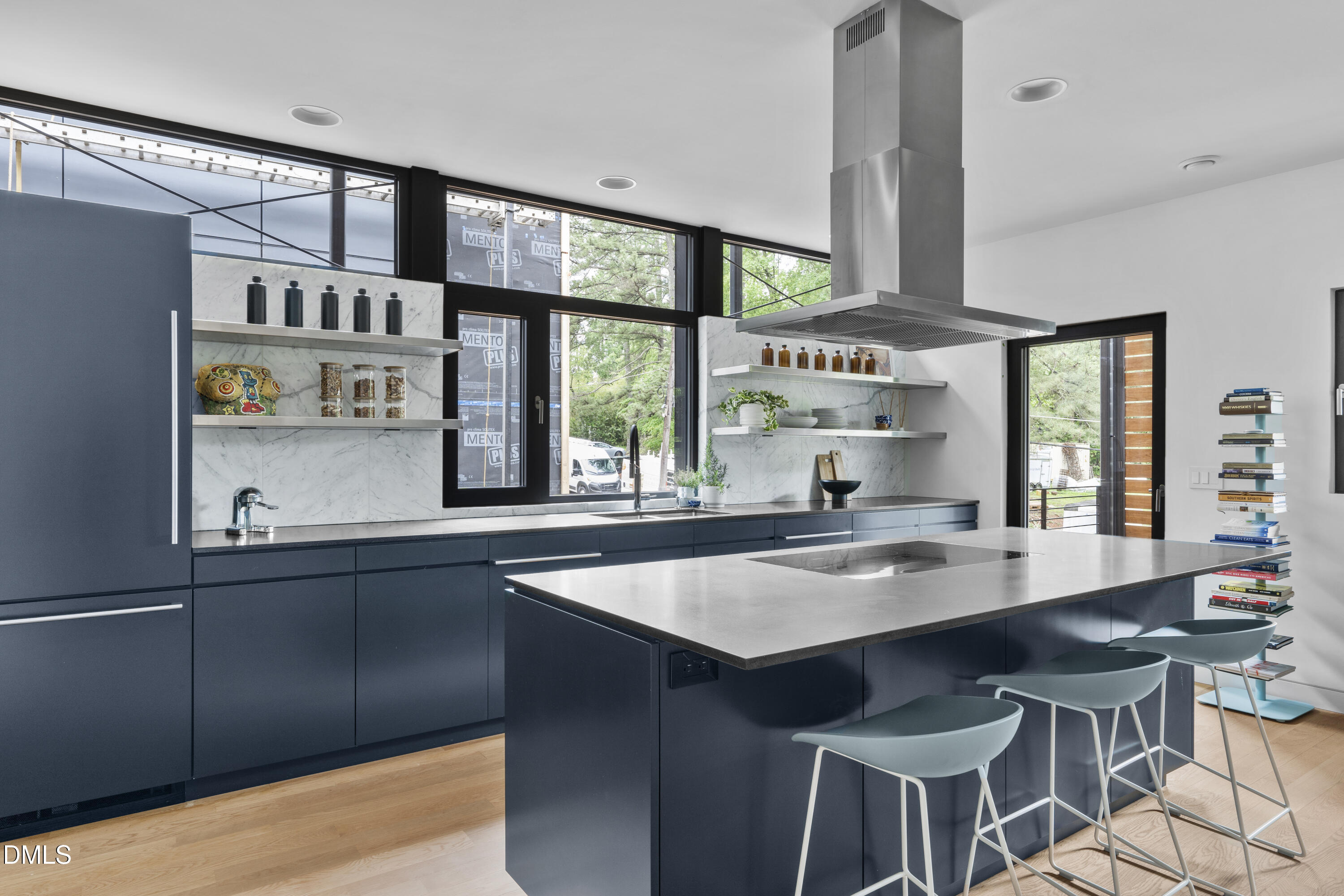 924 Tower Street Raleigh, NC 27607 - Photo 13 of 32 a kitchen with stainless steel appliances granite countertop a sink and a stove