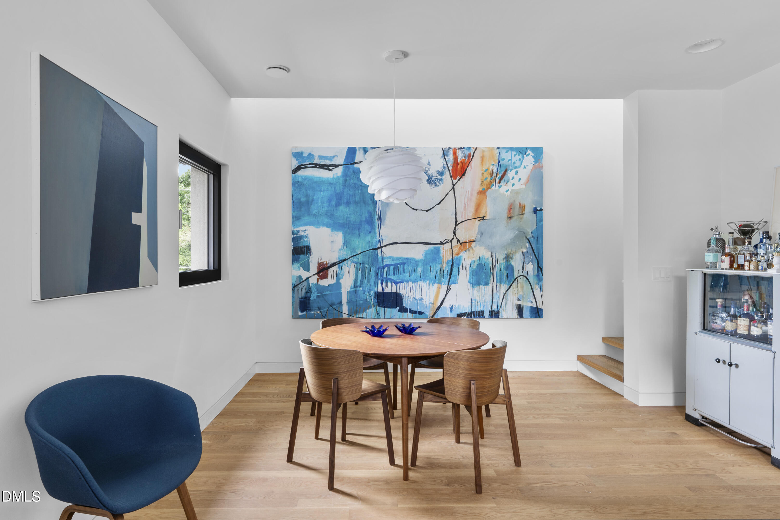 924 Tower Street Raleigh, NC 27607 - Photo 17 of 32 a dining room with furniture and wooden floor