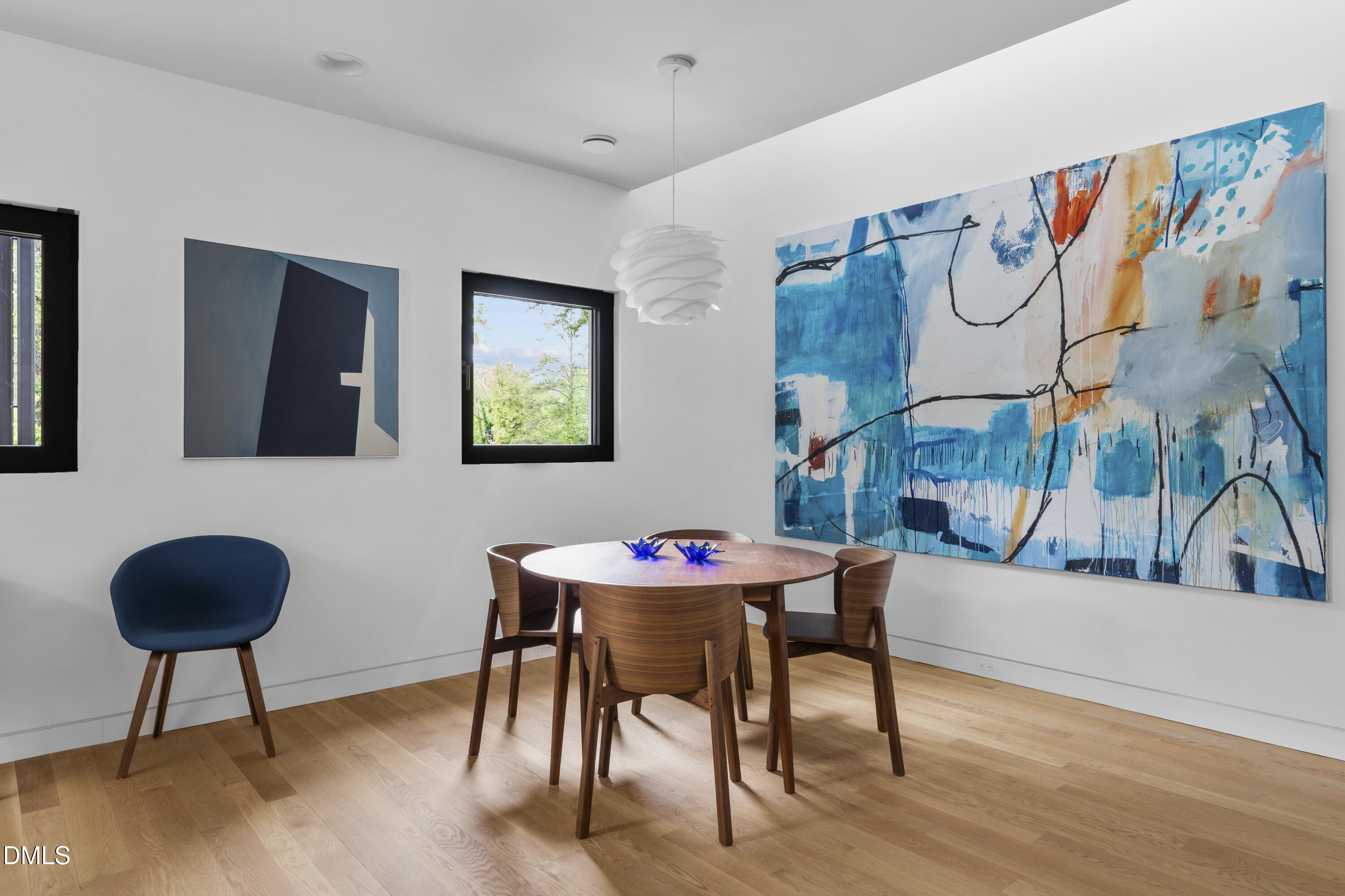 924 Tower Street Raleigh, NC 27607 - Photo 18 of 32 a dining room with furniture and wooden floor