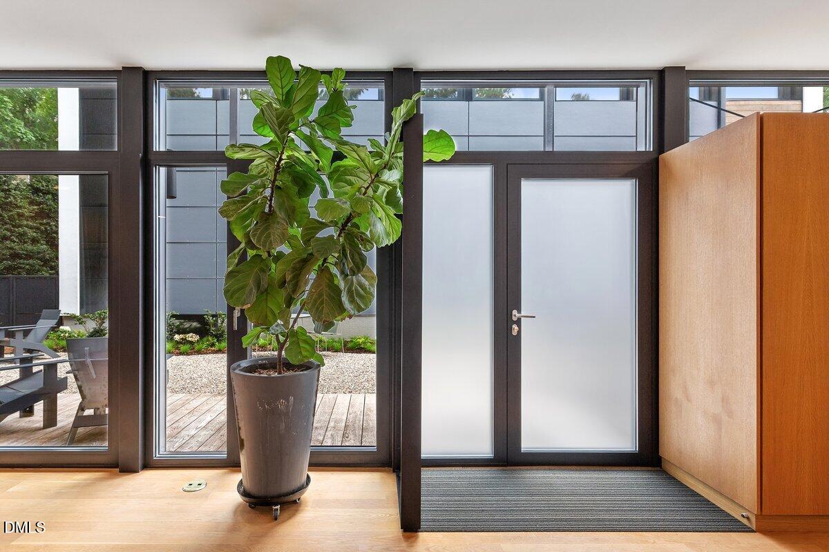 924 Tower Street Raleigh, NC 27607 - Photo 3 of 32 a white vase with flowers