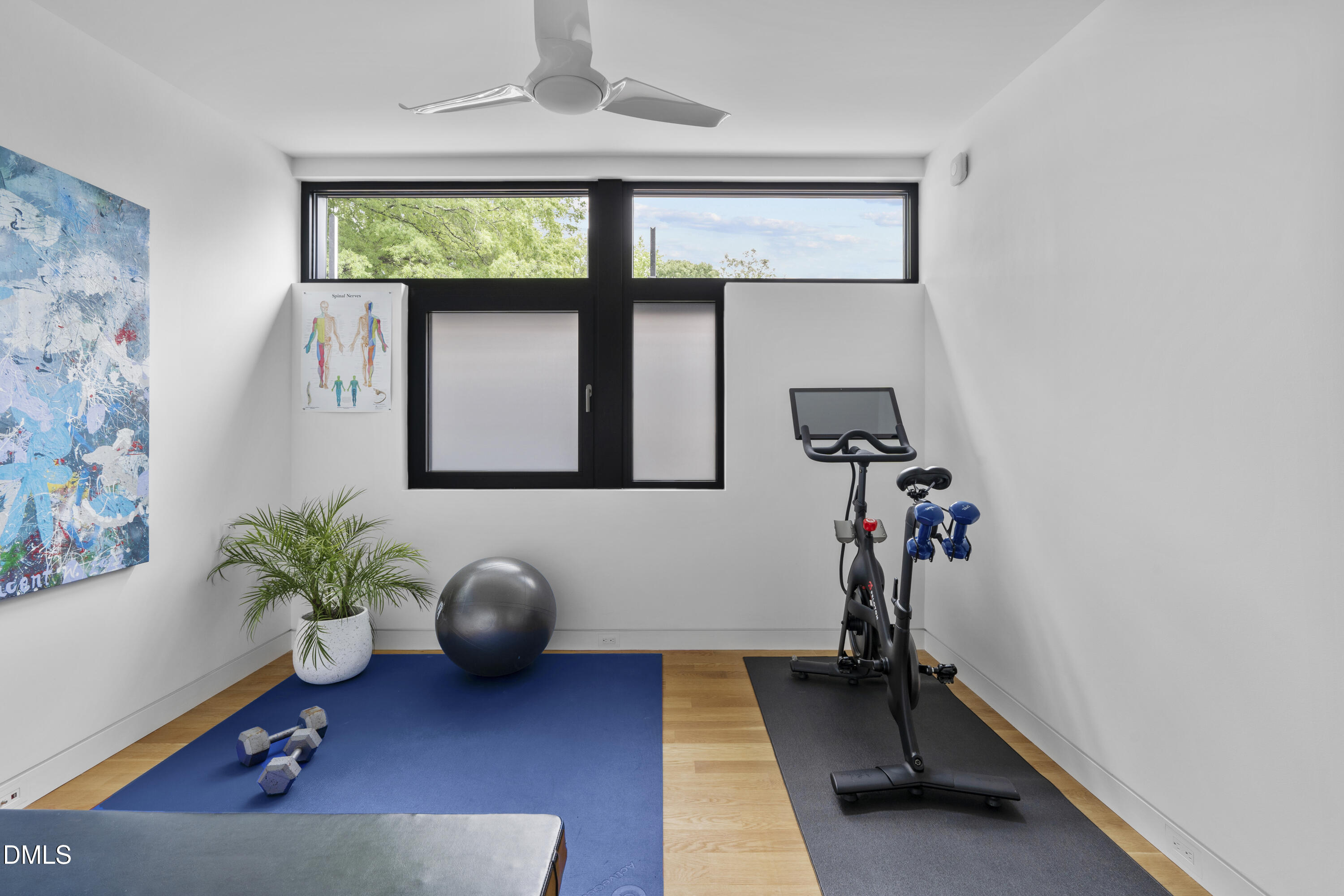 924 Tower Street Raleigh, NC 27607 - Photo 31 of 32 a living room with furniture plant and a window