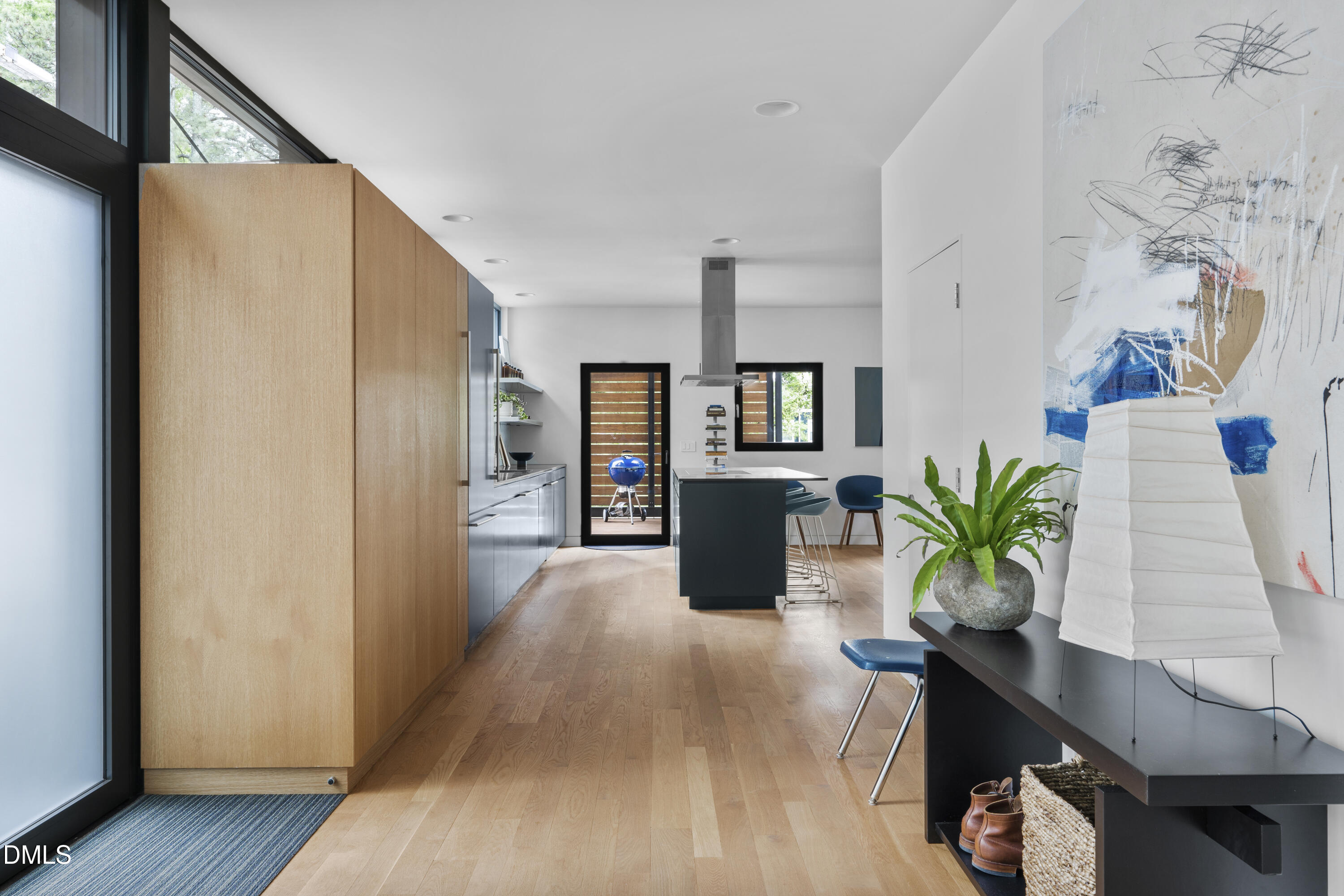 924 Tower Street Raleigh, NC 27607 - Photo 10 of 32 a living room with furniture and a potted plant
