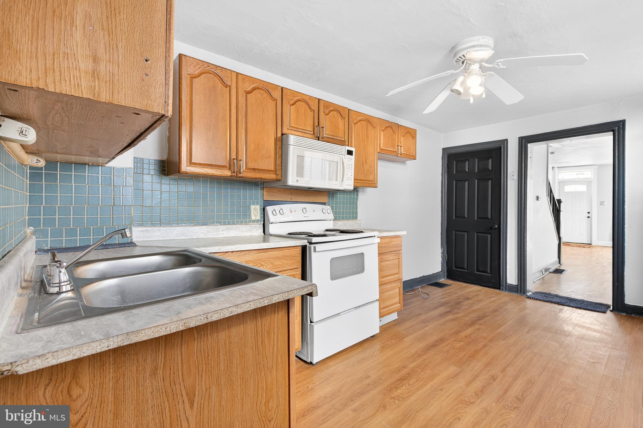 635 1st Street Lancaster, PA 17603 - Photo 11 of 32 a kitchen with granite countertop a sink stainless steel appliances and cabinets