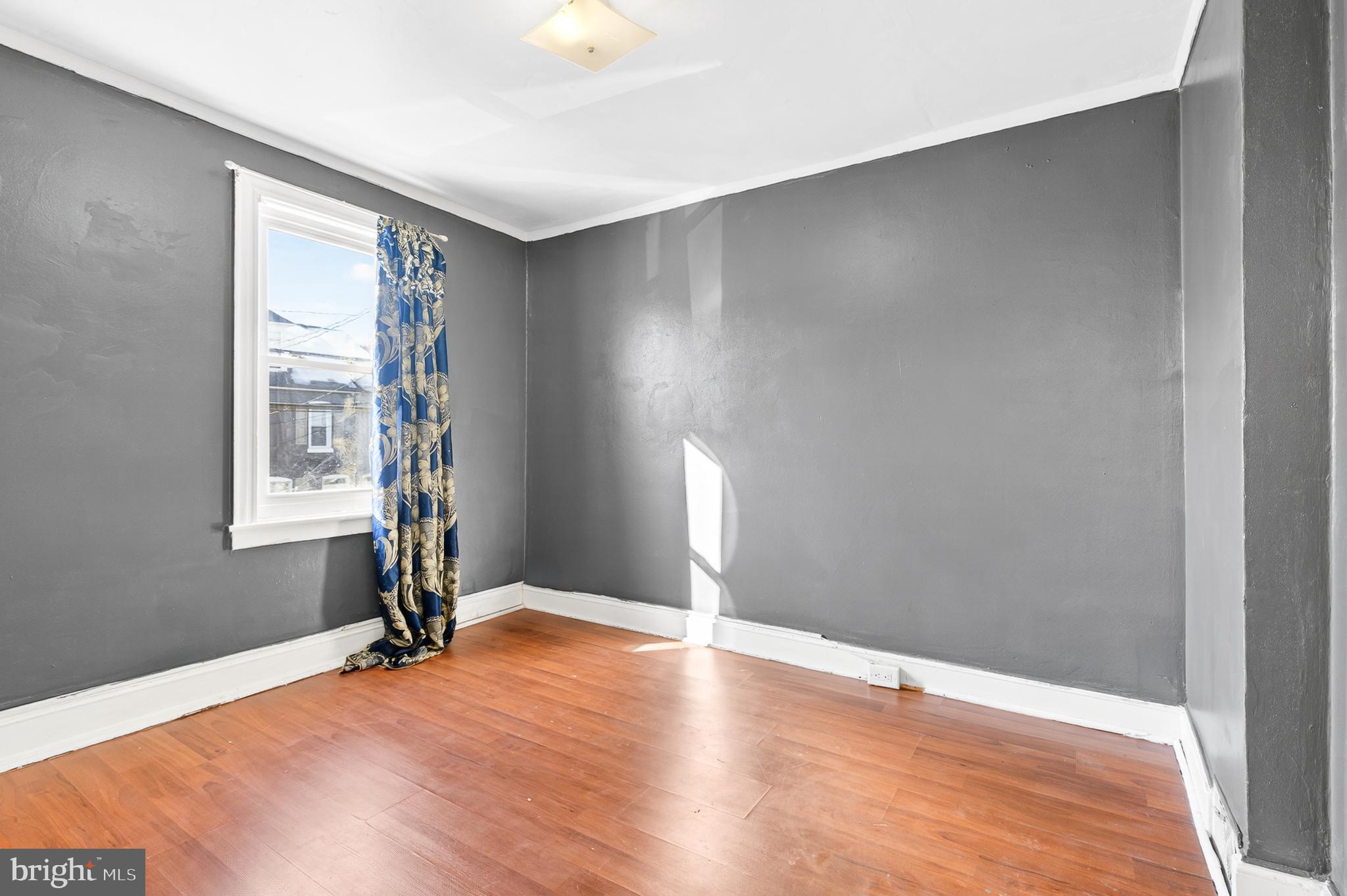 635 1st Street Lancaster, PA 17603 - Photo 16 of 32 a view of an empty room with window and wooden floor