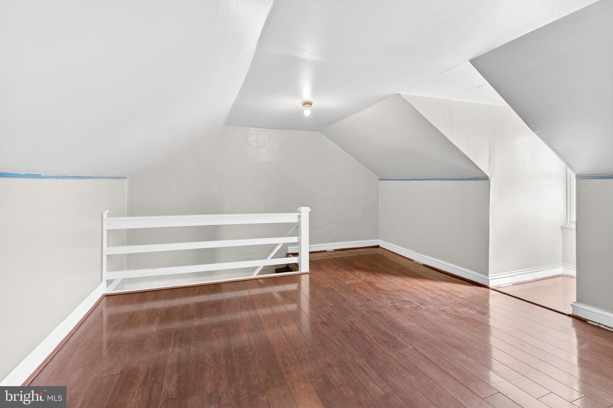 635 1st Street Lancaster, PA 17603 - Photo 22 of 32 a view of an empty room with wooden floor and a window