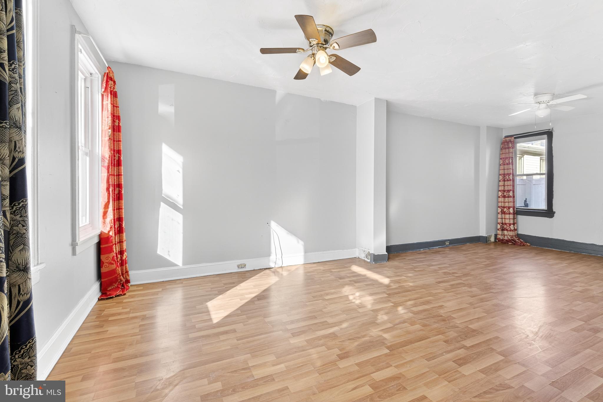 635 1st Street Lancaster, PA 17603 - Photo 5 of 32 a view of an empty room with window and wooden floor