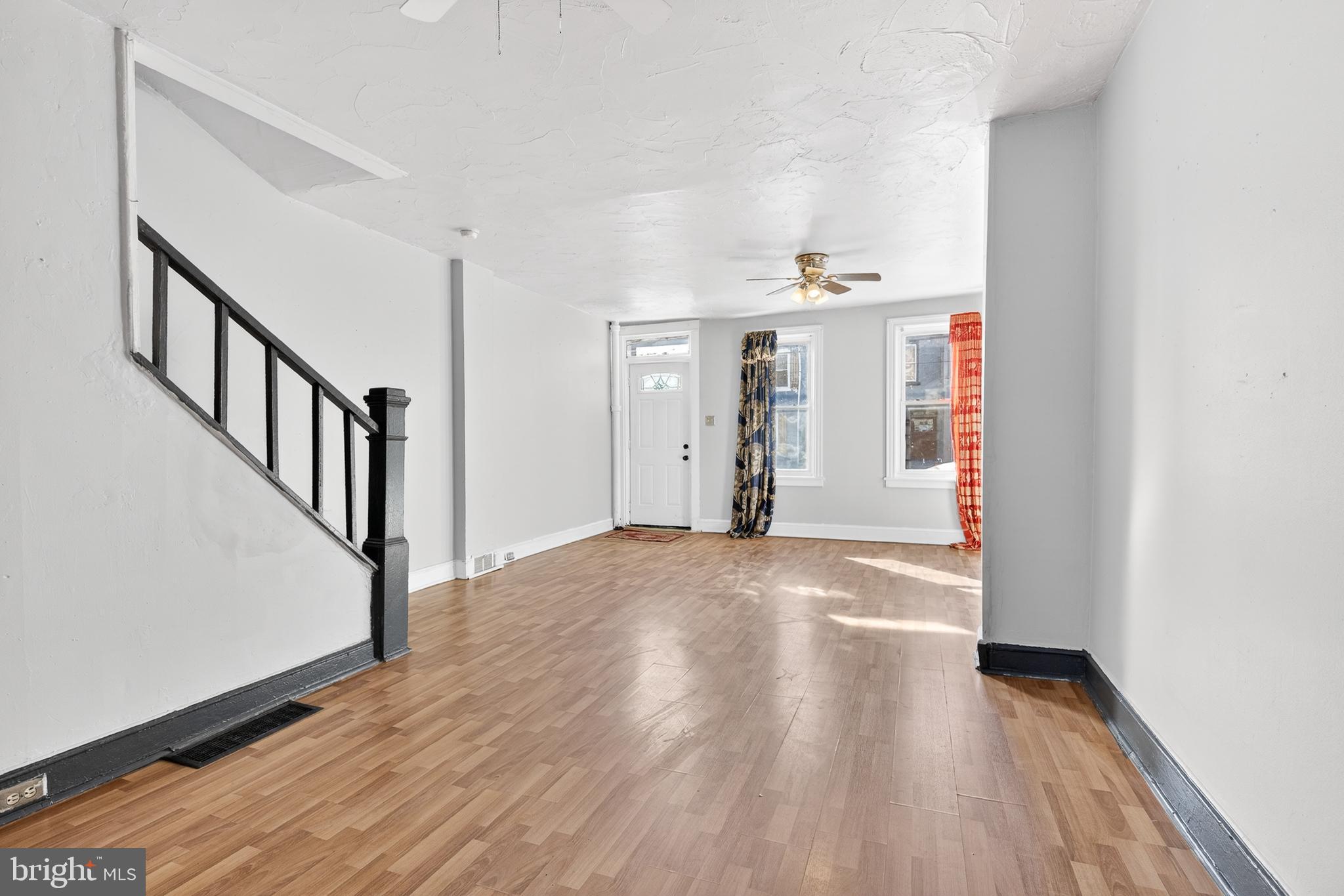 635 1st Street Lancaster, PA 17603 - Photo 7 of 32 a view of a hallway with wooden floors and stairs