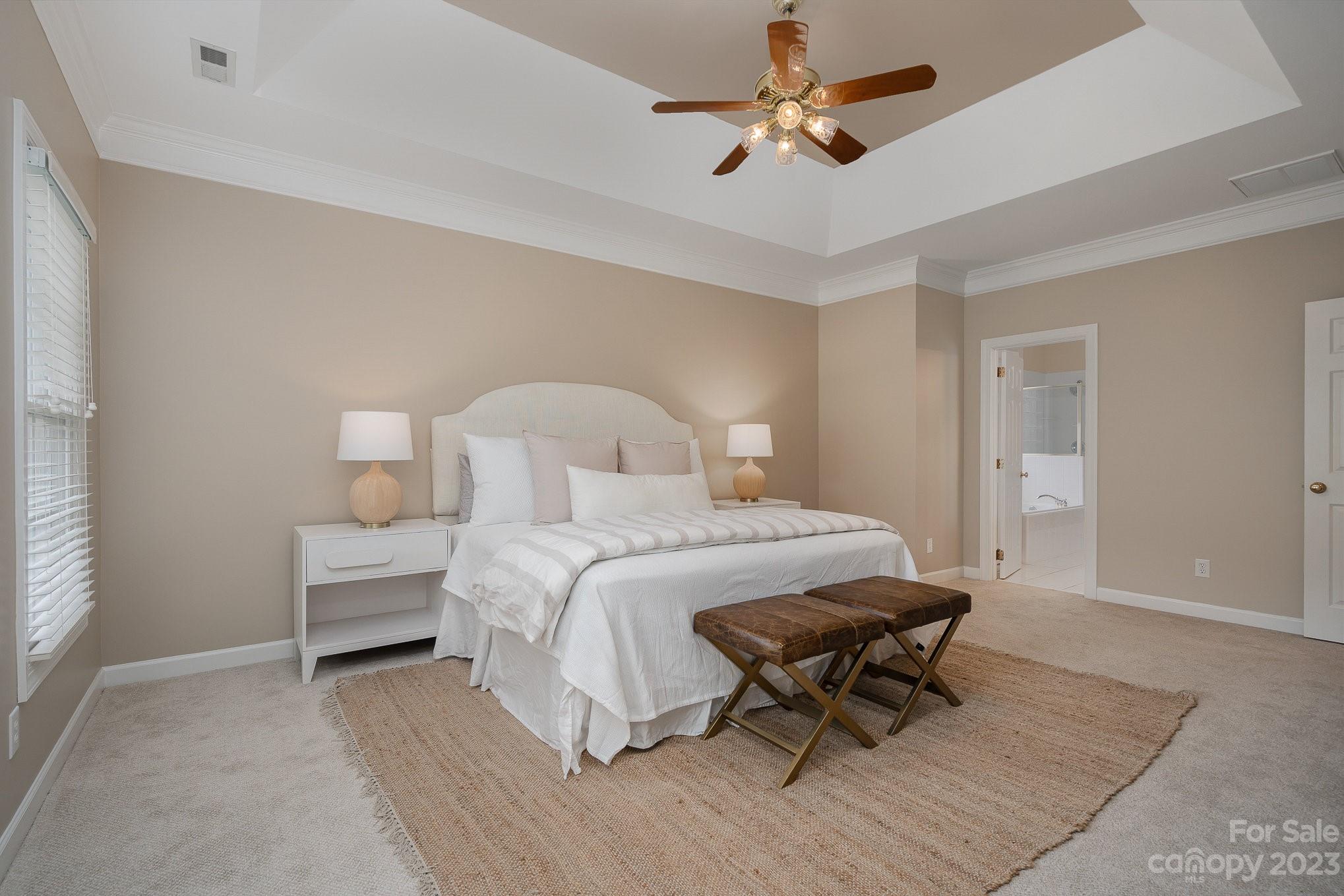 230 Sardis Pointe Road Matthews, NC 28105 - Photo 20 of 42 a bedroom with a bed a rug and a chair