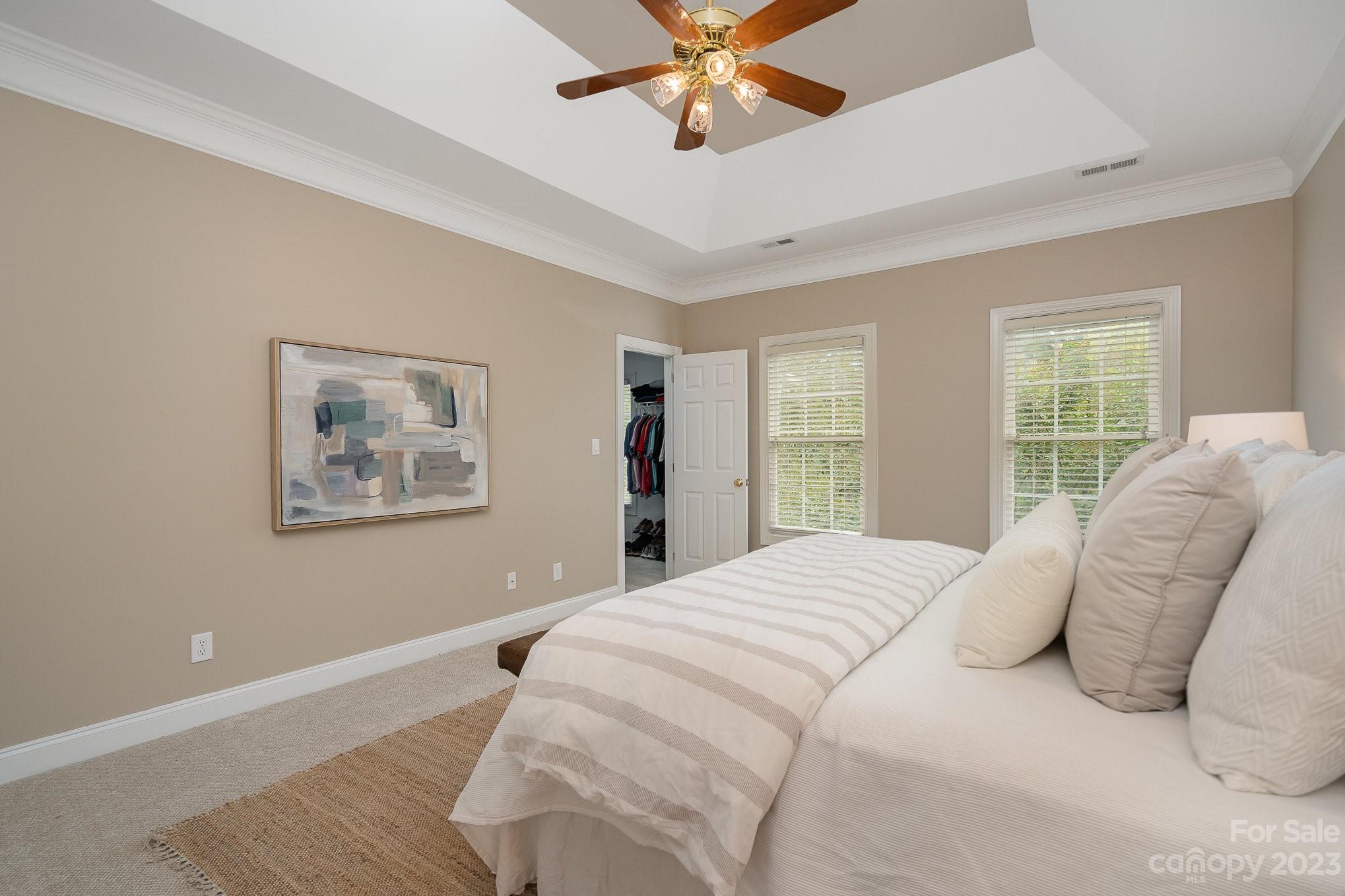 230 Sardis Pointe Road Matthews, NC 28105 - Photo 21 of 42 a bedroom with a large bed and a window