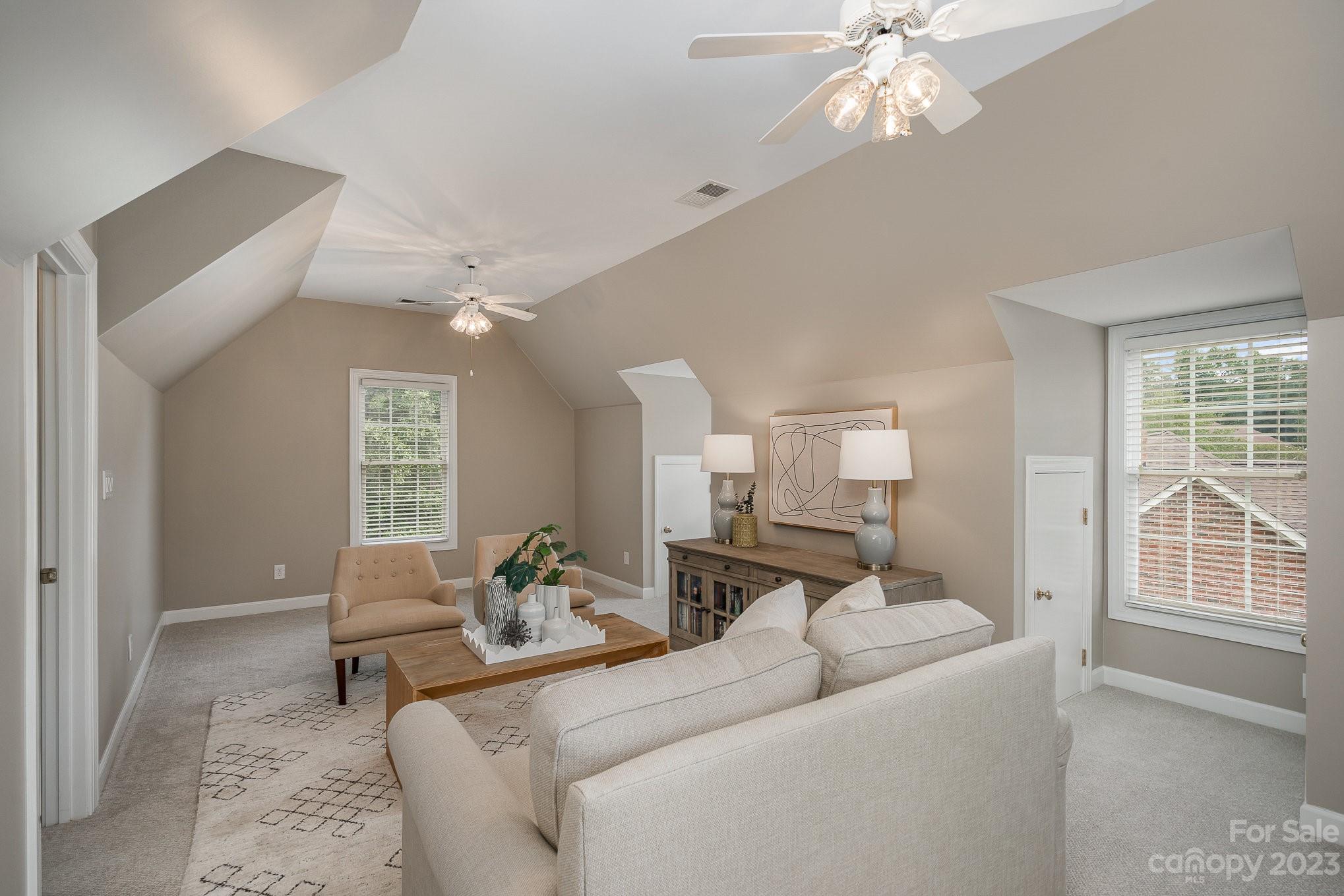 230 Sardis Pointe Road Matthews, NC 28105 - Photo 34 of 42 a living room with furniture and a large window