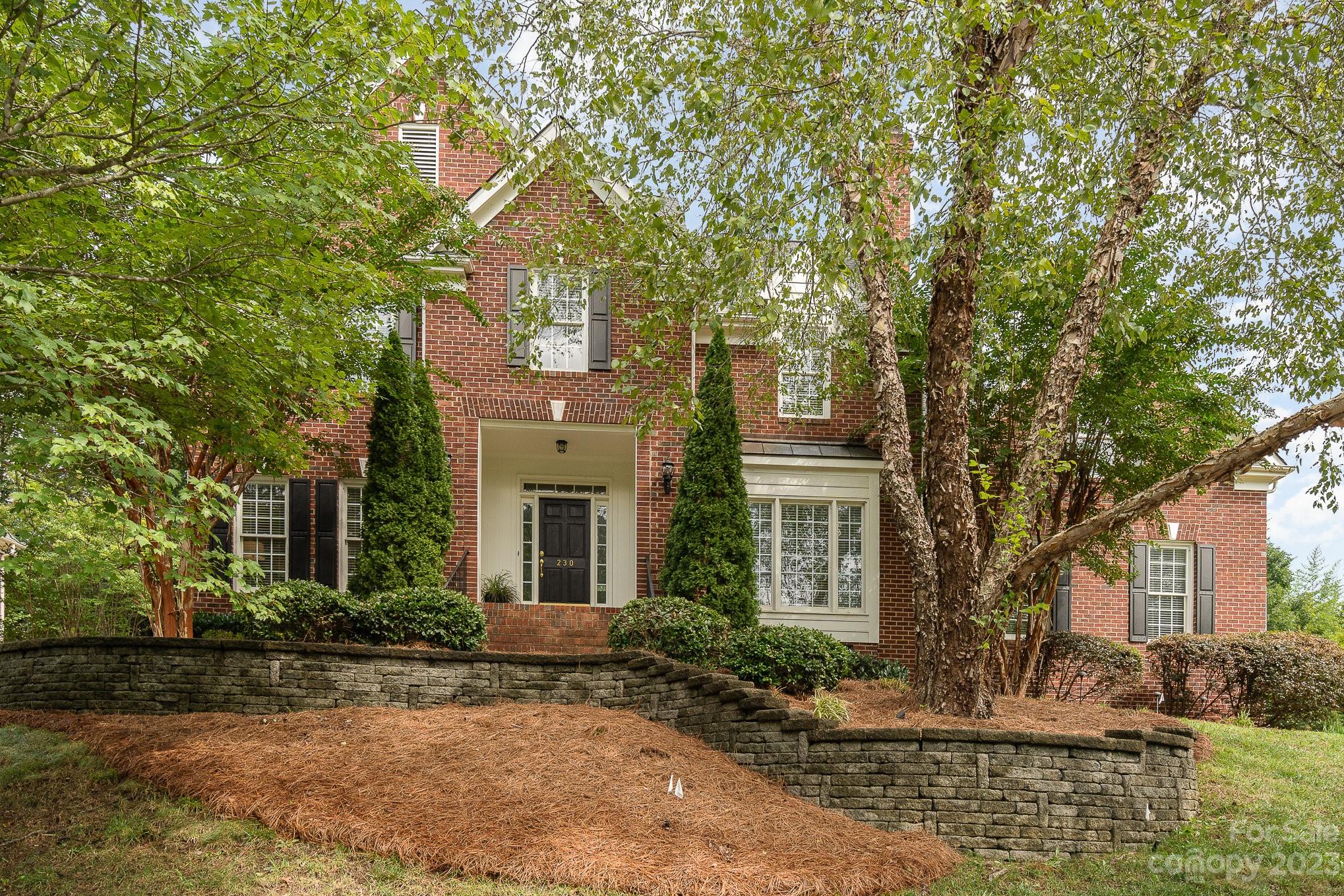 230 Sardis Pointe Road Matthews, NC 28105 - Photo 41 of 42 a front view of a house with a yard