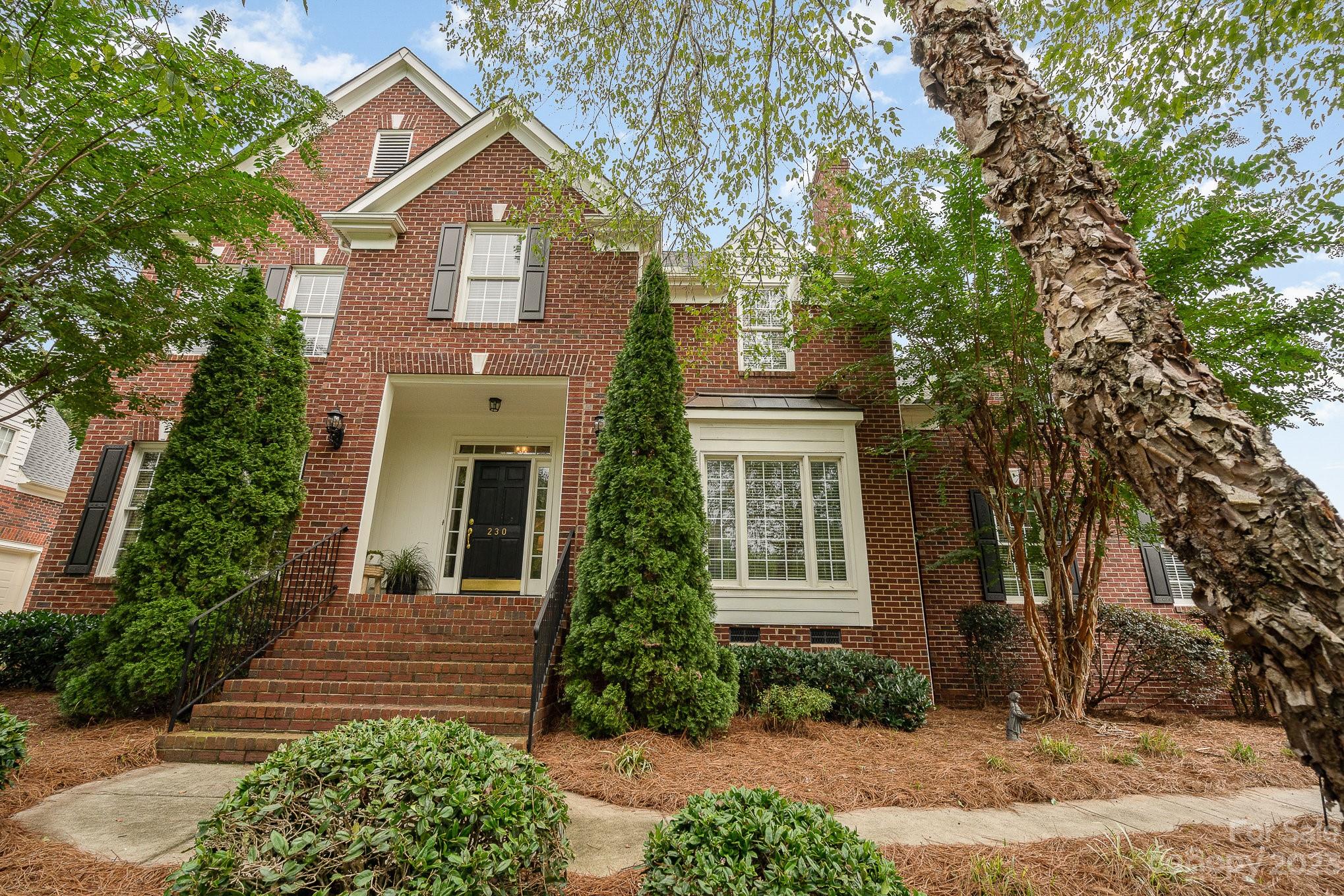 230 Sardis Pointe Road Matthews, NC 28105 - Photo 42 of 42 a front view of a house with a yard