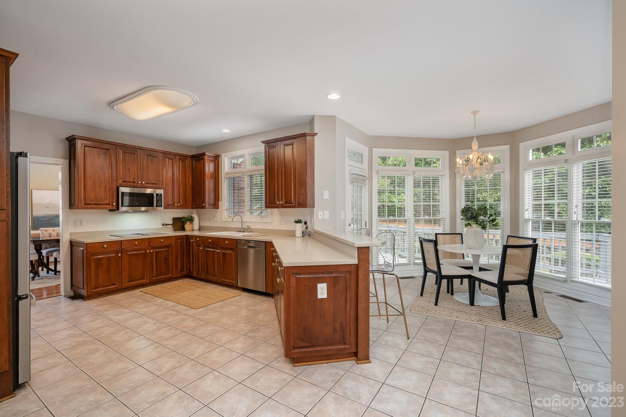 230 Sardis Pointe Road Matthews, NC 28105 - Photo 8 of 42 a kitchen with a cabinets and counter space