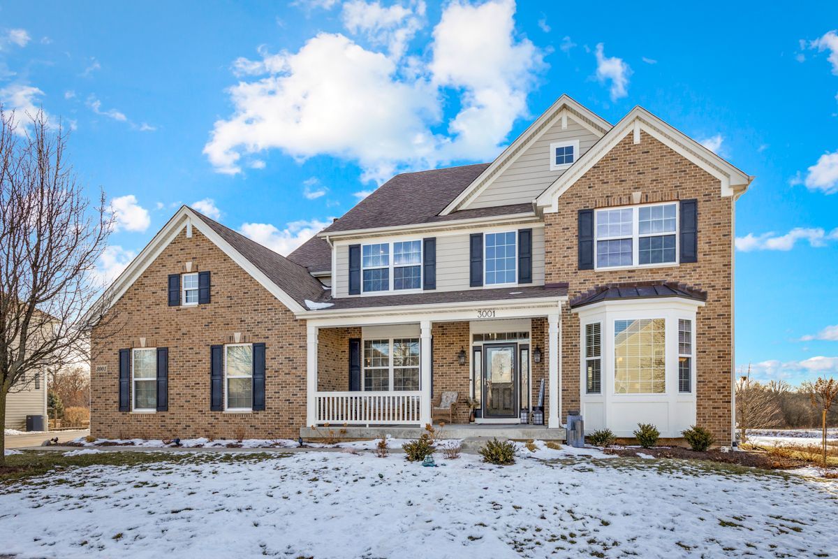 3001 Wagon Road Elgin, IL 60124 - Photo 1 of 39 a front view of a house with a yard