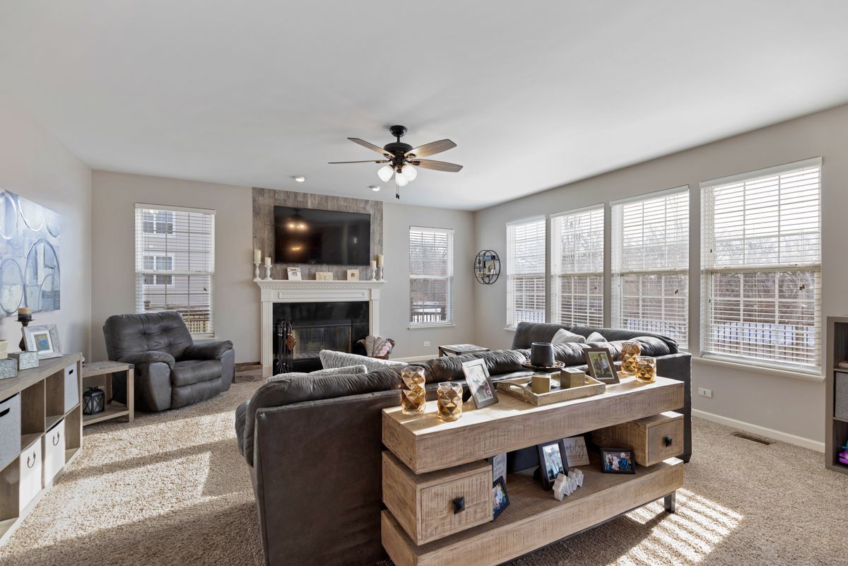 3001 Wagon Road Elgin, IL 60124 - Photo 13 of 39 a living room with furniture fireplace and large windows