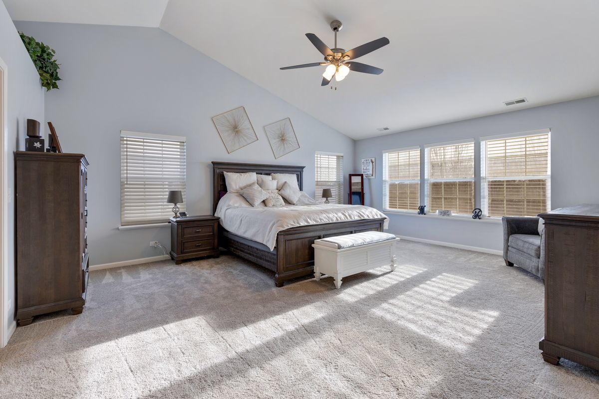 3001 Wagon Road Elgin, IL 60124 - Photo 14 of 39 a spacious bedroom with a bed a table and large window